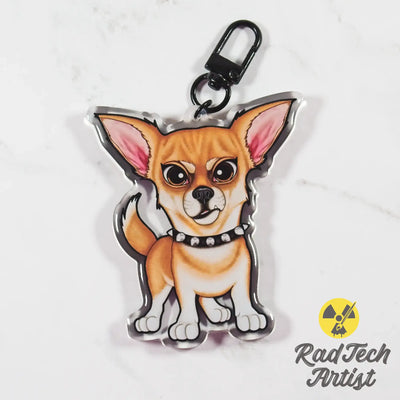 a fawn colored Chihuahua-shaped keychain on a white background