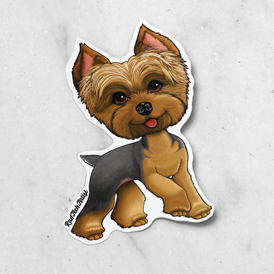 Sticker of a blue and gold Yorkie on a marble background
