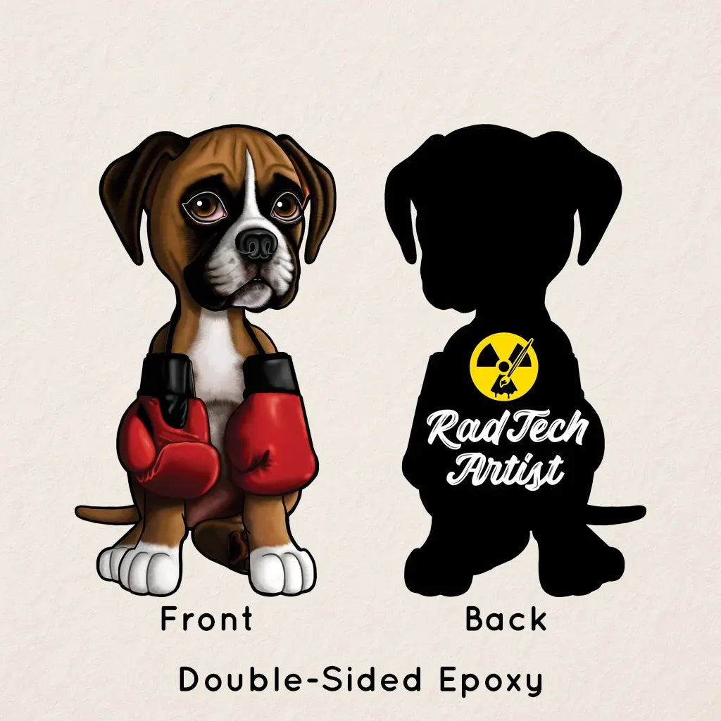 Double-sided epoxy boxer puppy keychain with red boxing gloves, showing front illustration and back Rad Tech Artist logo on a beige background.