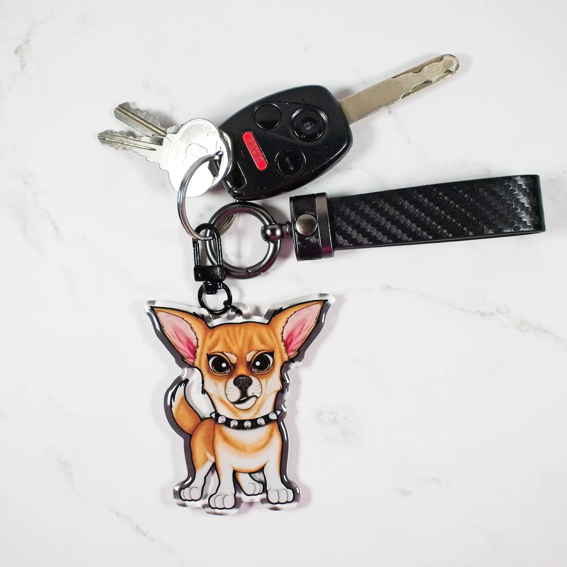 Keychain with a fawn Chihuahua dog design attached to a set of keys on a white background
