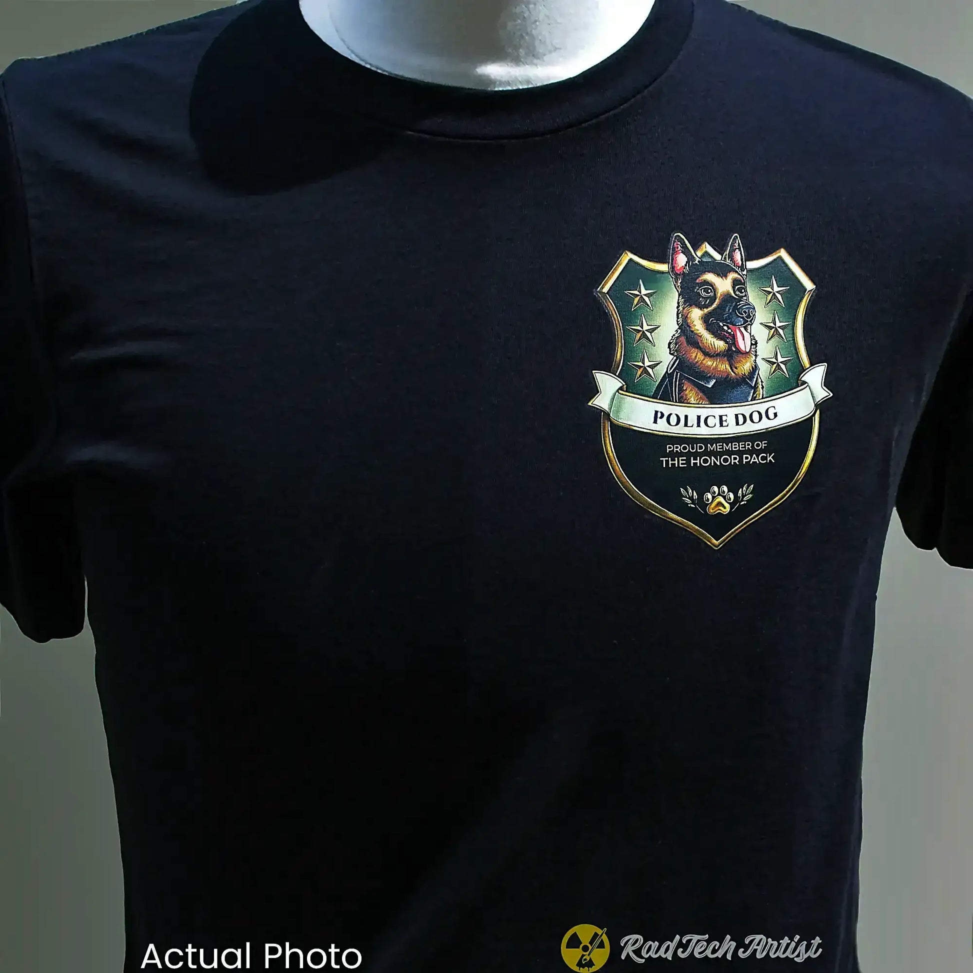 Black t-shirt with a German Shepherd police dog emblem on a mannequin against a gray background.