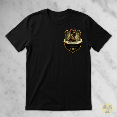 A black short-sleeve crewneck t-shirt featuring a German Shepherd police dog crest graphic on the left chest, laid flat on a light gray marble-textured background.