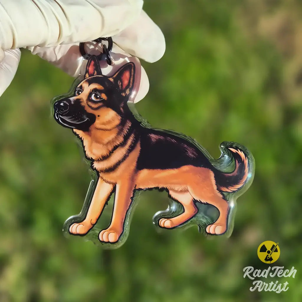 Close-up of a German Shepherd acrylic keychain highlighting the black and tan coloring and glossy epoxy finish.