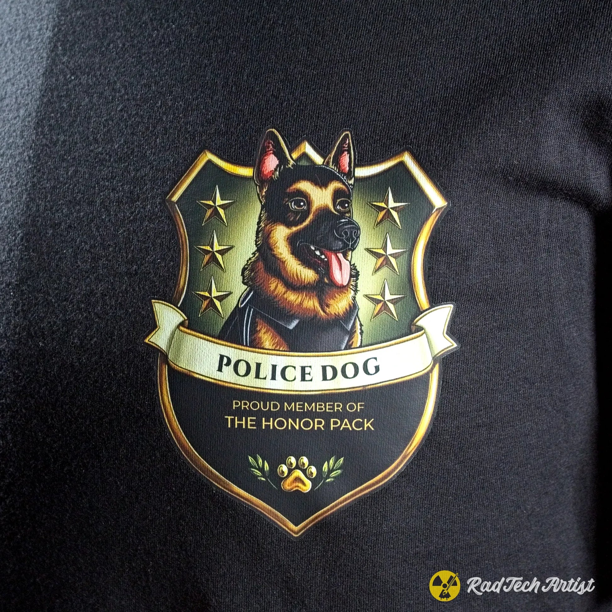 a close-up shot of an Emblem of a German Shepherd police dog on a black background with text 'Proud Member of the Honor Pack'.