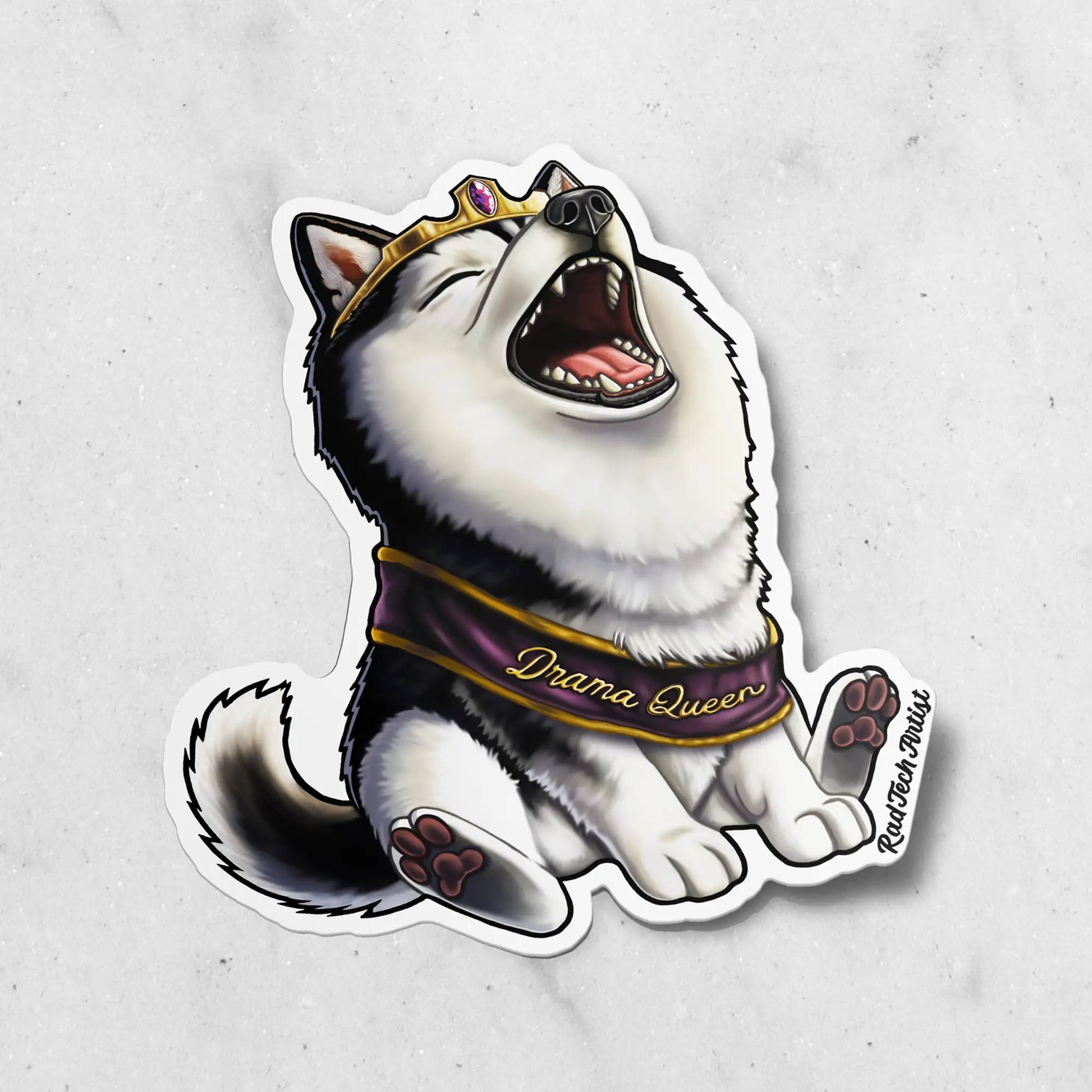 A Sticker of a black and white Siberian Husky wearing a gold Tiara and a purple and gold sash. The sash says "Drama Queen. The Sticker is on a marble background.