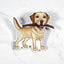Magnet of a yellow Labrador Retriever with a stick on a white background