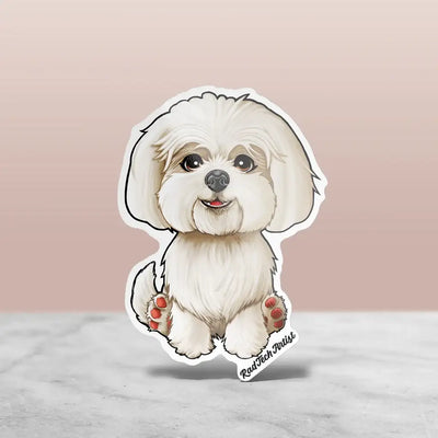 White Maltese sticker with a soft coat, sitting relaxed with aback paws forward and pink paw pads showing.
