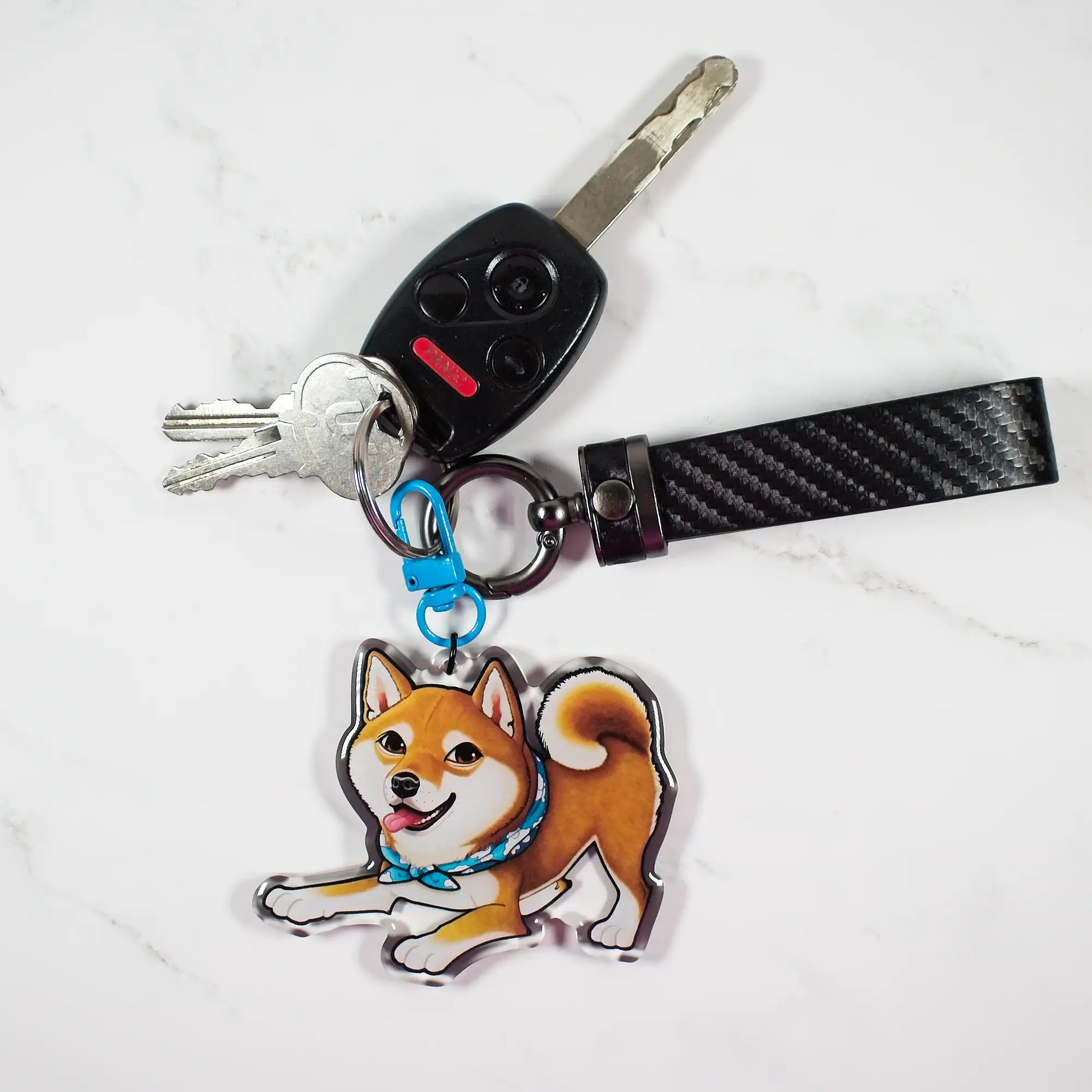 Keychain with a red Shiba Inu dog design attached to a set of keys on a white background
