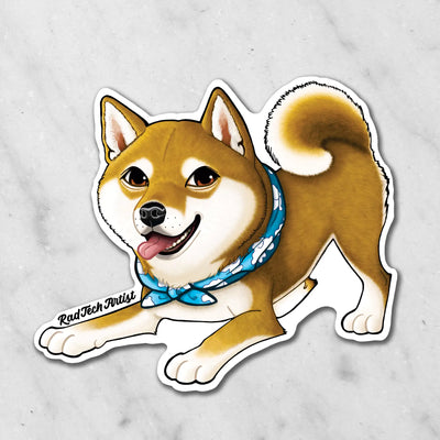 Magnet of a red Shiba Inu dog with a blue bandana on a marble surface