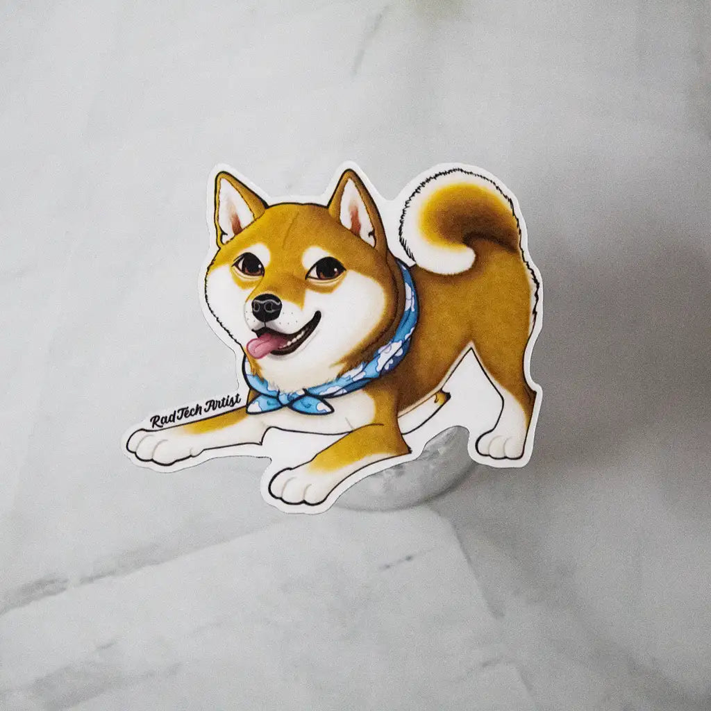 Shiba Inu dog magnet with red coat and blue bandana displayed on a glass stand over a marble background.