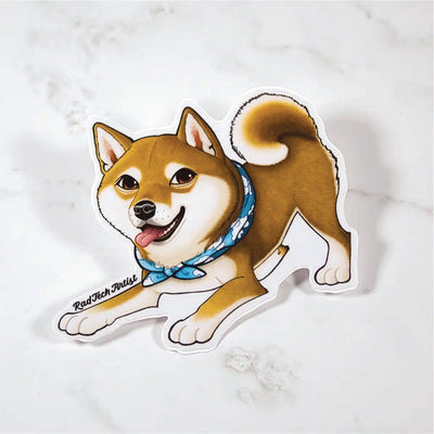 Sticker of a red Shiba Inu dog with a blue bandana on a marble surface