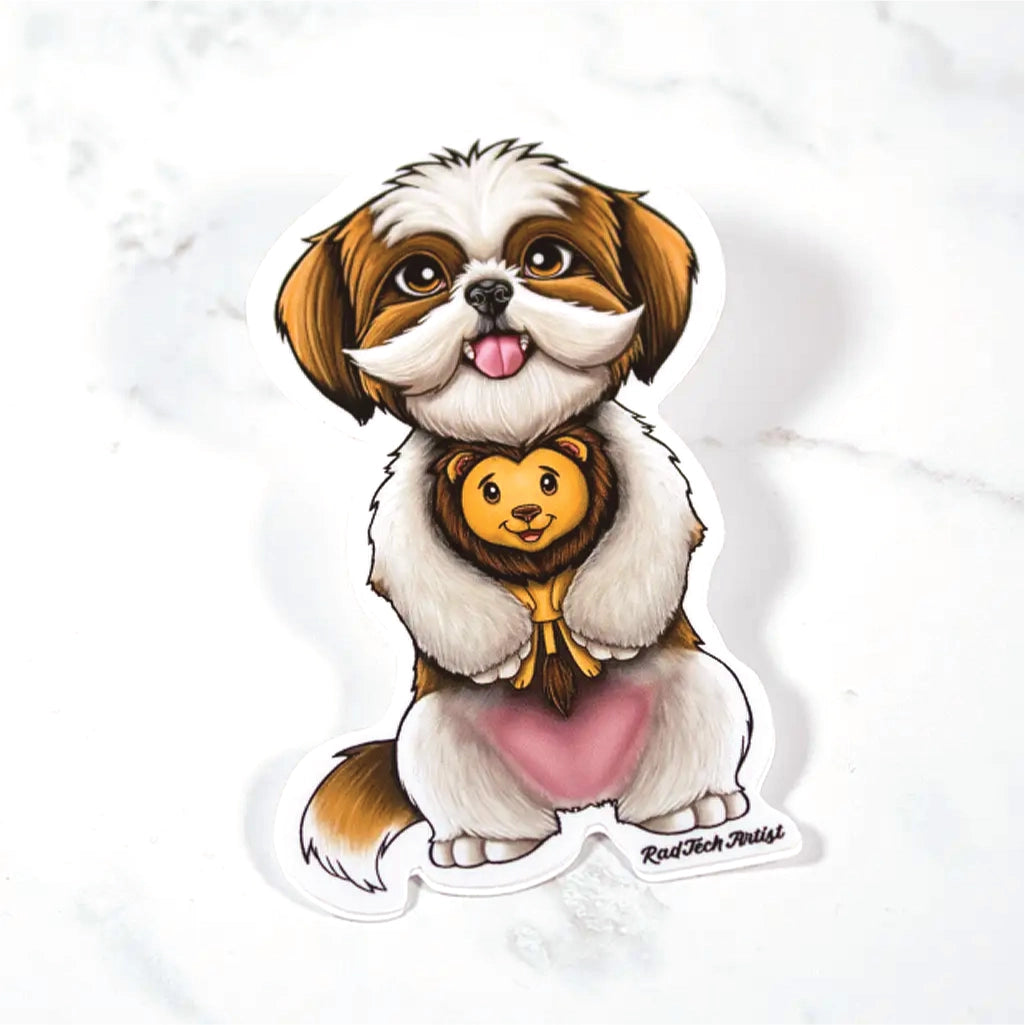 Sticker of a gold and white Shih Tzu with a lion plush toy on a marble surface