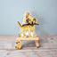 Vinyl dog sticker of a yellow Lab holding a stick on brown surface – waterproof Labrador sticker for dog lovers.