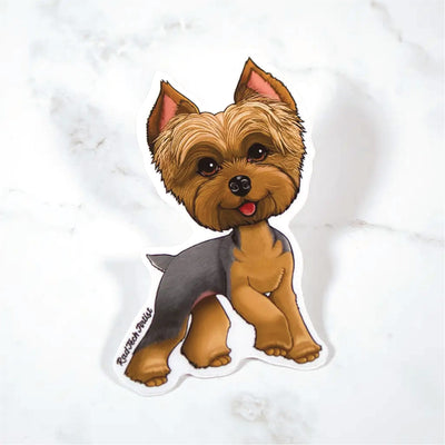 Sticker of a blue and gold Yorkshire Terrier on a marble surface