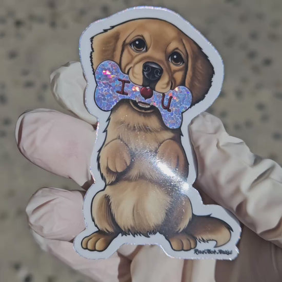 Short video showing a Golden Retriever vinyl sticker with a glitter “I ♥ U” bone being tilted in the light to highlight the sparkling effect.